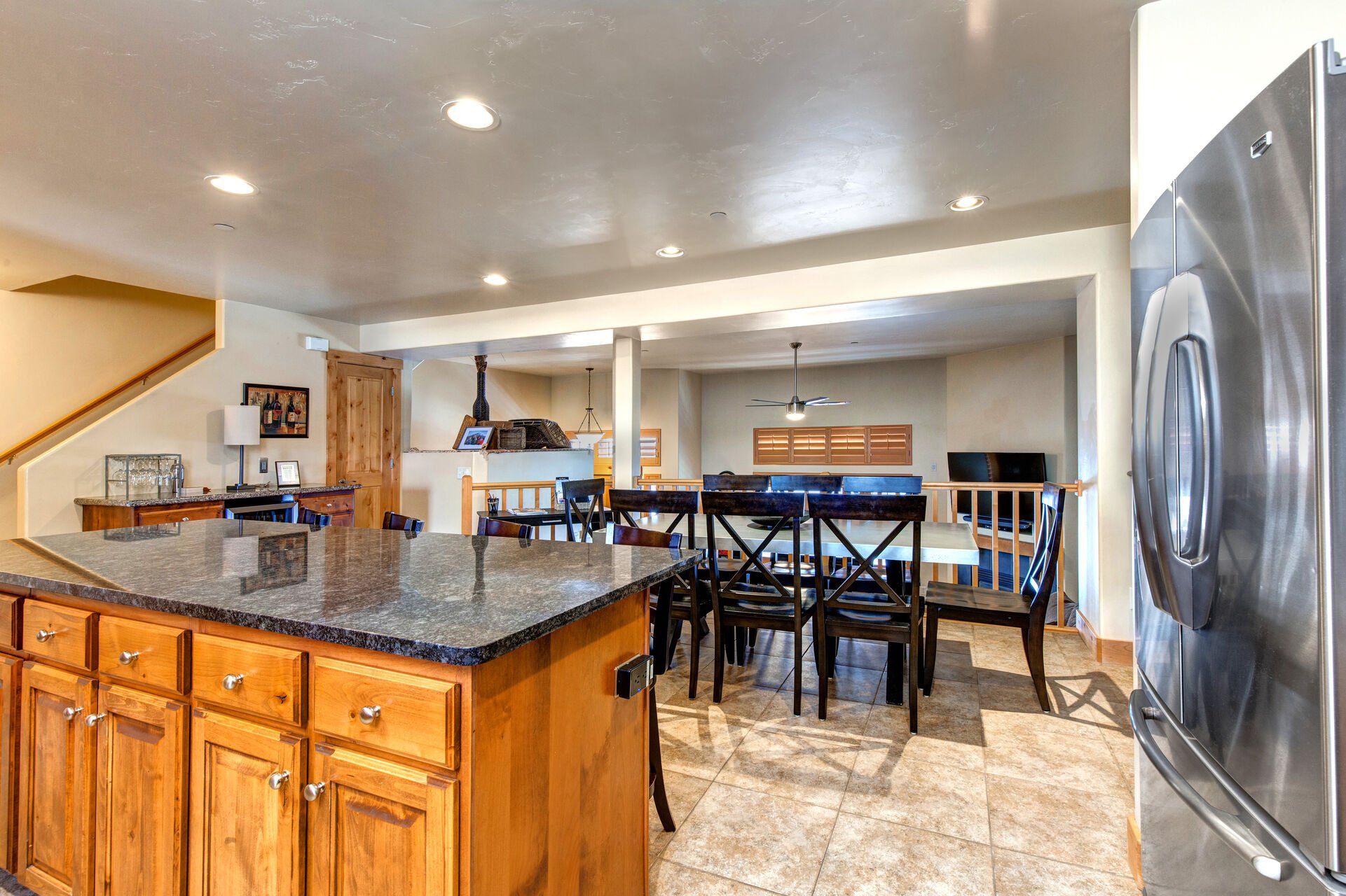 Kitchen with Stainless Steel Appliances, Ice-Maker, Wine Fridge, Stone Countertops, and Large Island with Seating for 4
