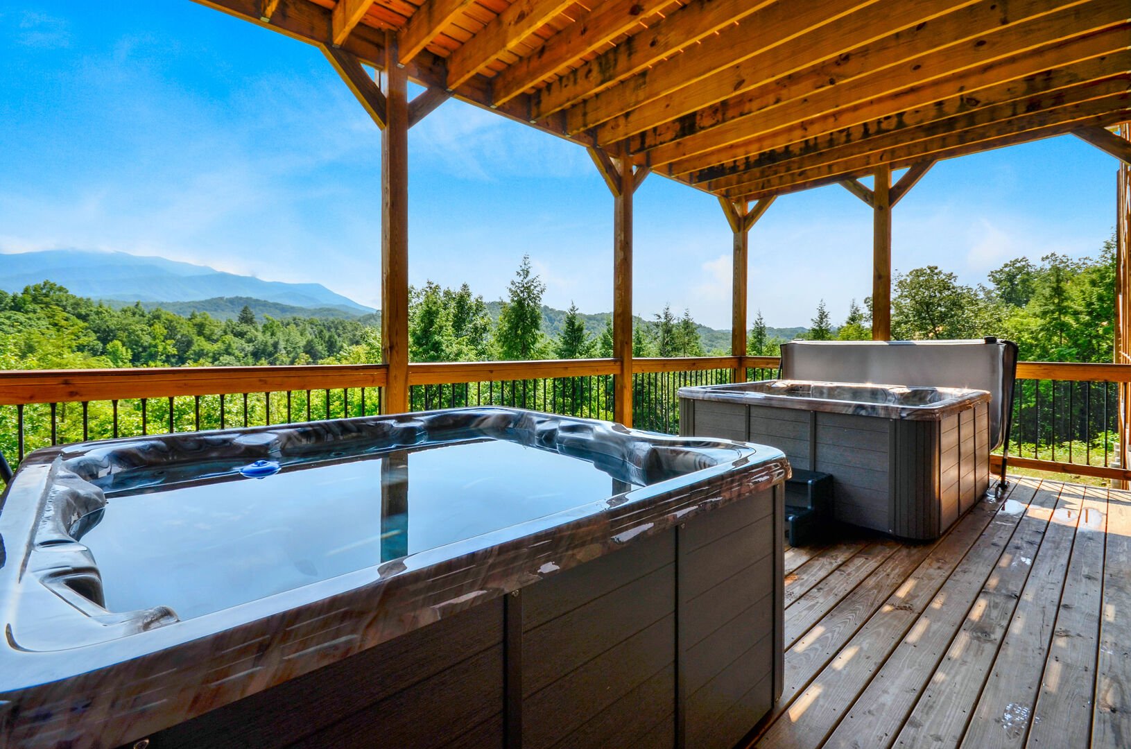 Two hot tubs on the balcony of this Vacation rental near Gatlinburg TN.