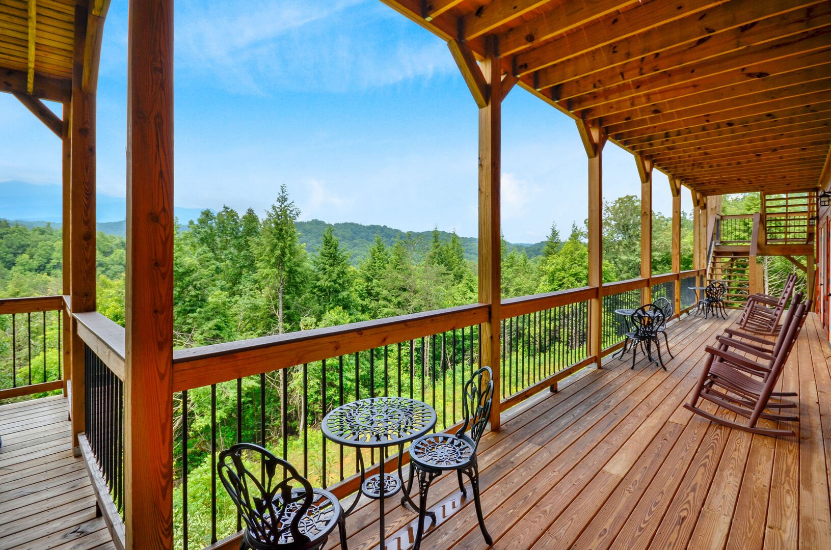 The balcony of this Vacation rental near Gatlinburg TN with seating and great views.