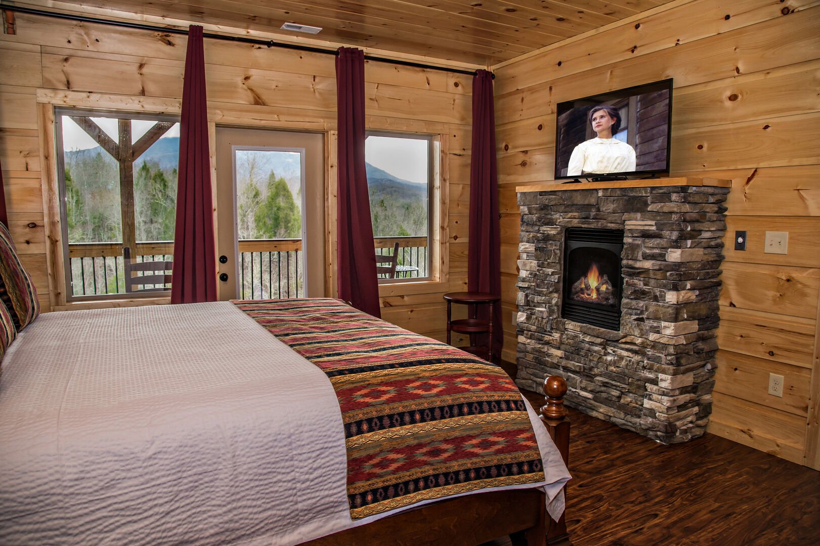 Guests Can Enjoy a Fireplace and TV in Bedroom.