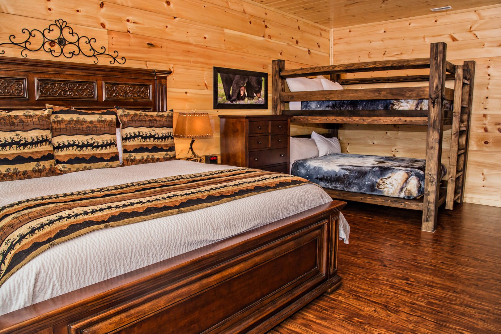 Bedroom Includes Large Bed and a Bunk Bed.
