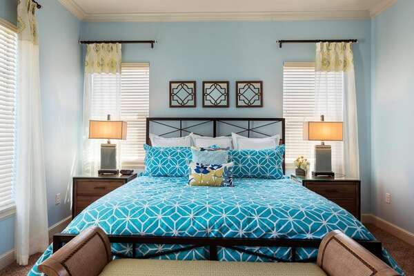 Bright accents of color and soft floral arrangements add flair to upstairs master suite 5 bedroom