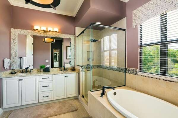 Master suite bathroom 2 includes a rain shower head and touches of stone decor