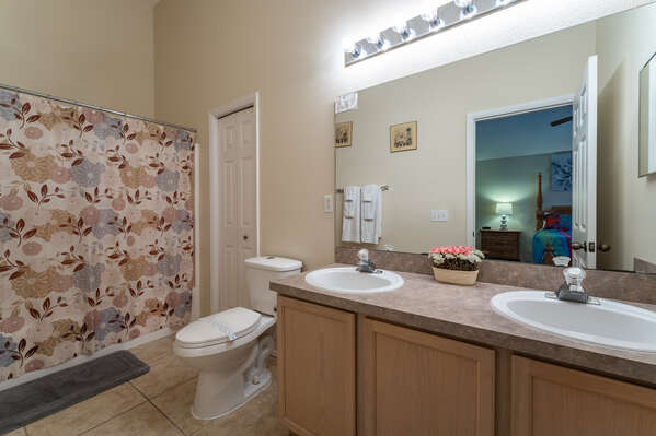 Master bath with shower tub combo and dual sink vanity