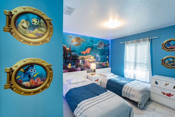 Bedroom 3 with themed mural and TV