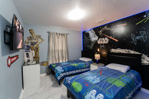 Bedroom 4 with themed mural and TV