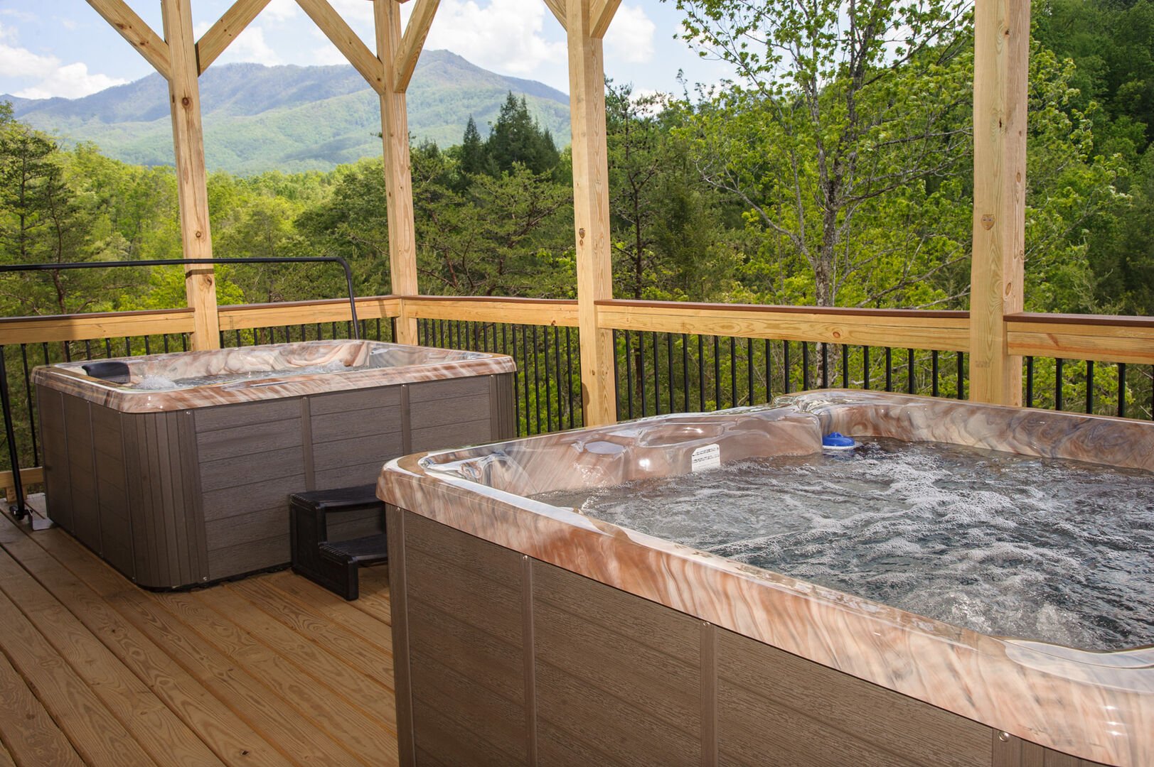 Two Hot Tubs in the Upper-Level Deck with Mountain View.