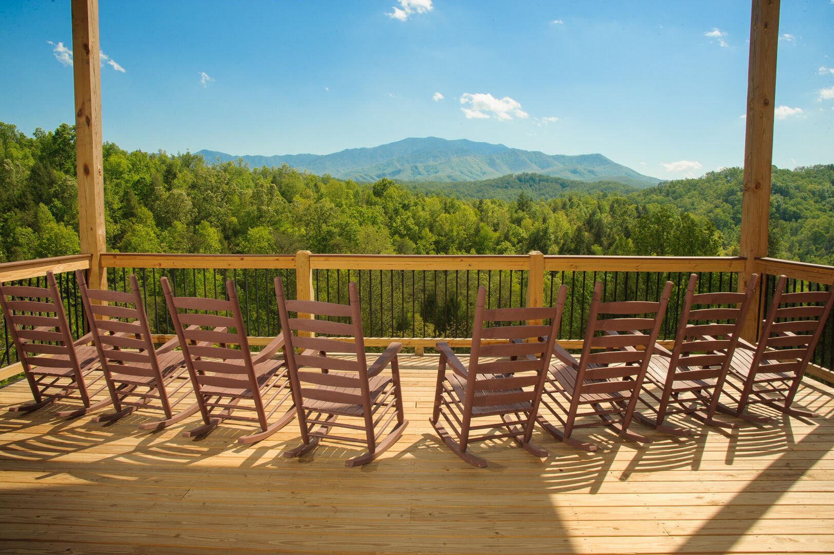 Eight Rocking Chairs in the Upper-Level Deck with Mountain View.