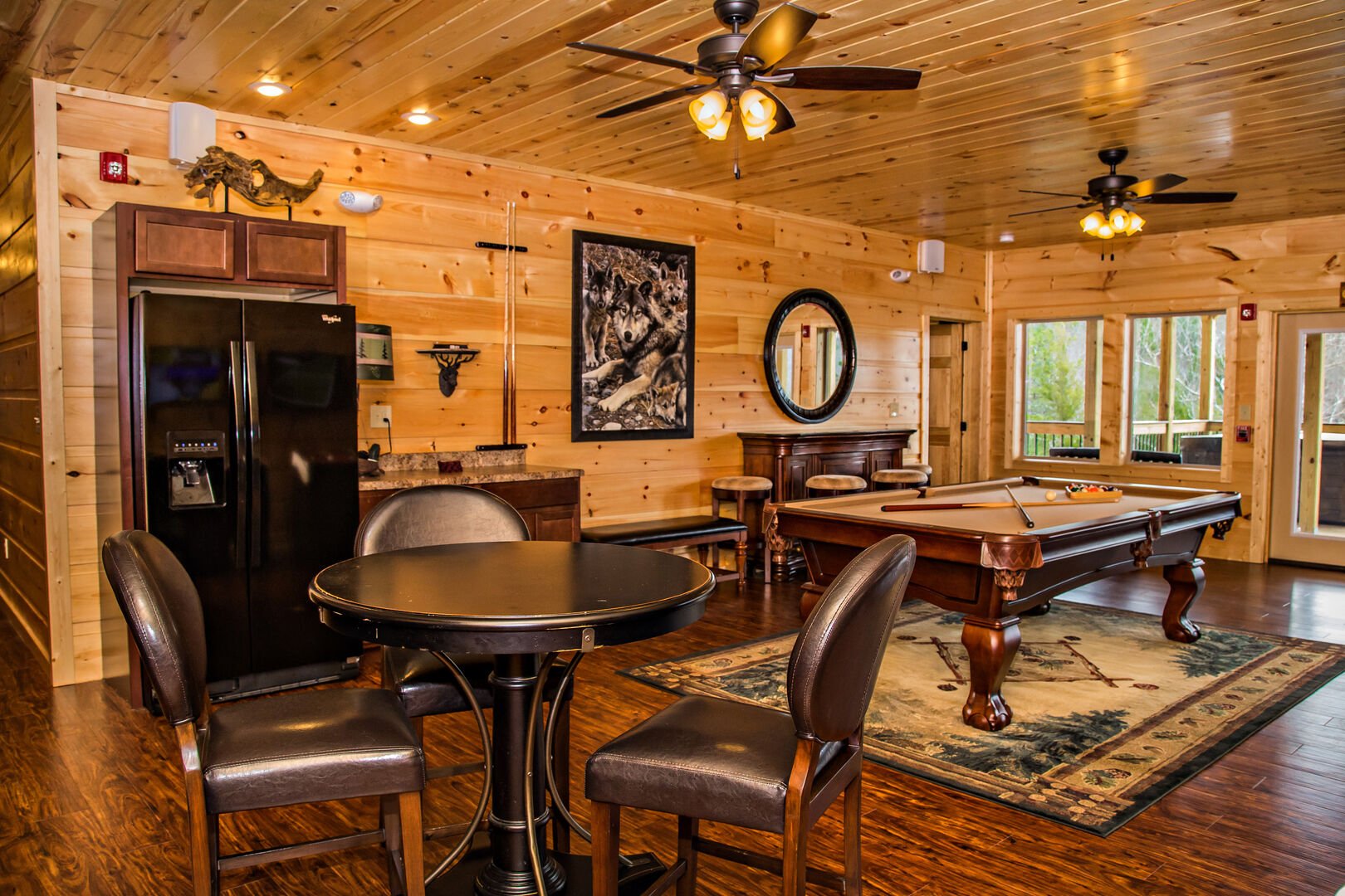 Game Room with Refrigerator, Wet Bar, Pool Table, Table, Chairs, and Stools.