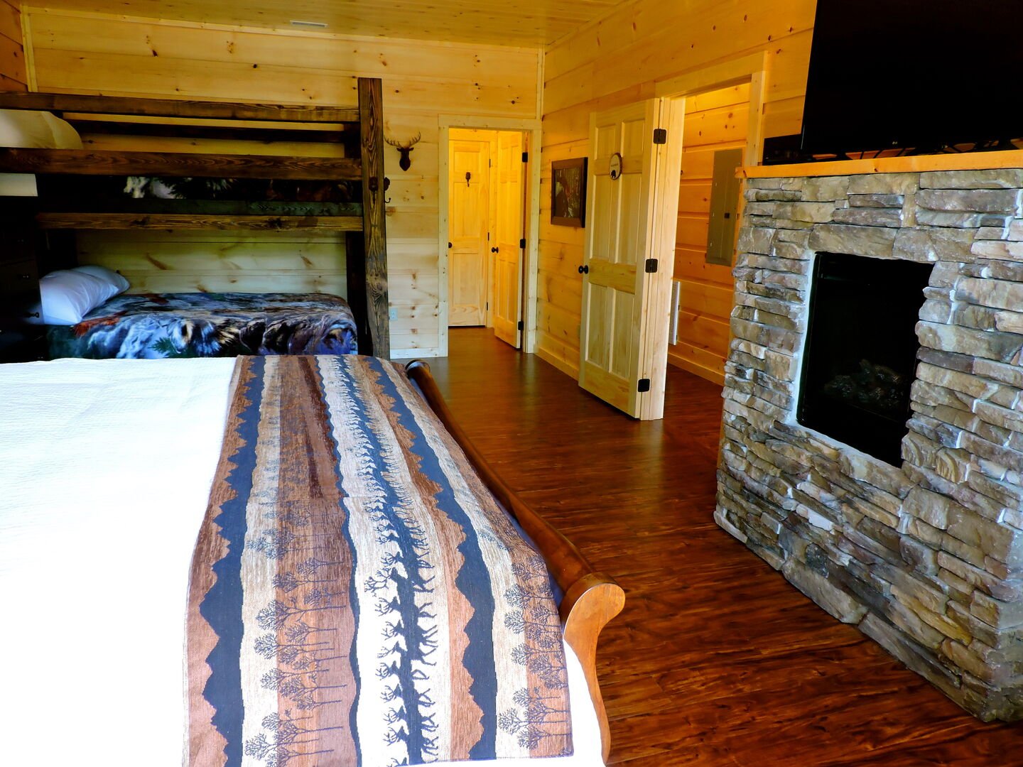 Fireplace, Large Bed, and Bunk Bed.