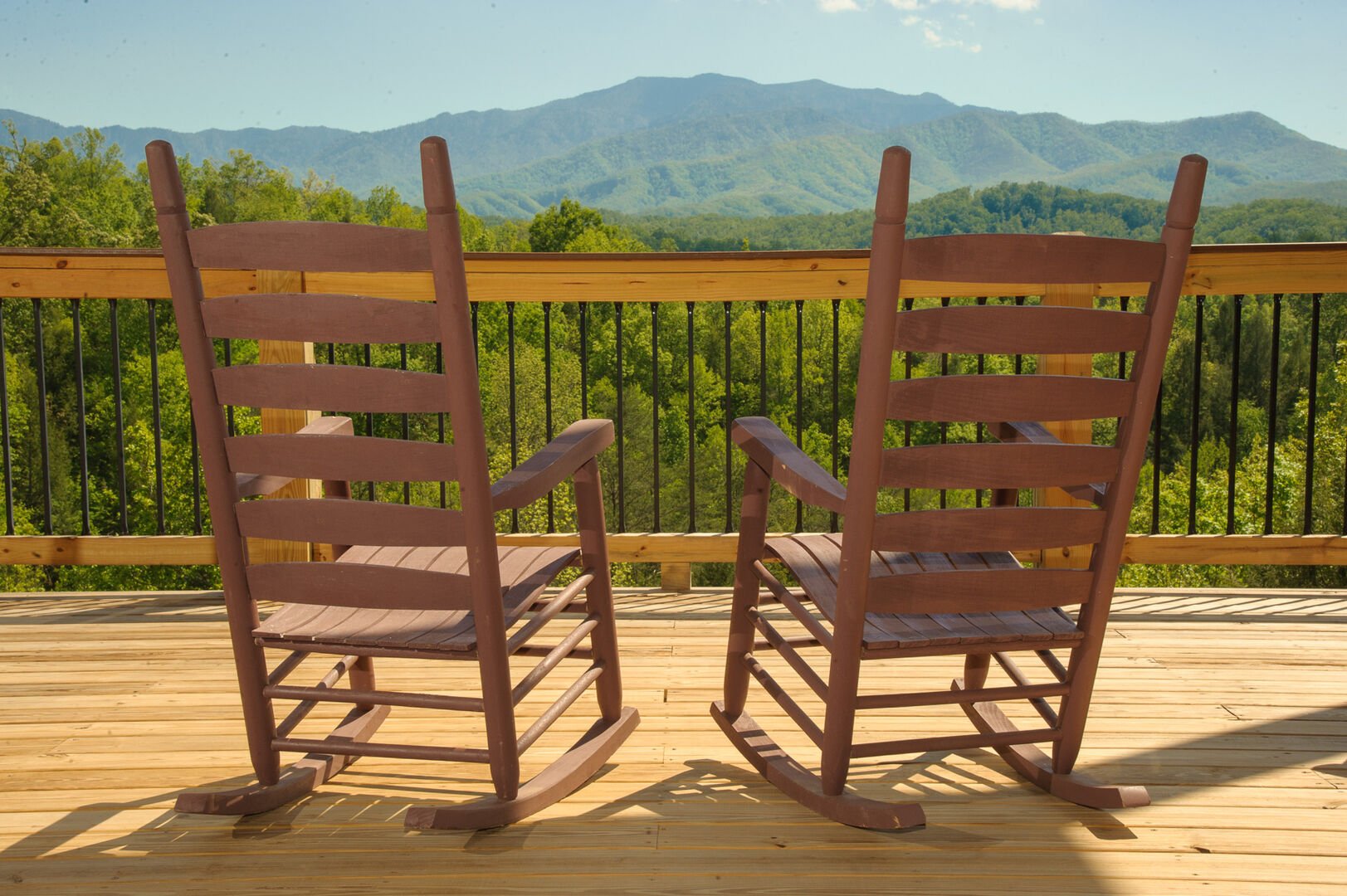 A Couple of Rocking Chairs in the Deck with Mountain View.