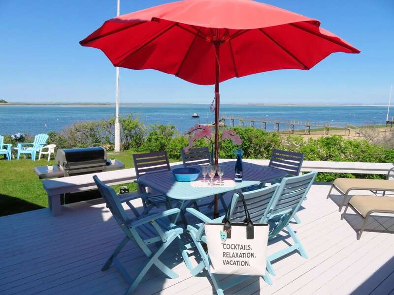 Deck off to the right of the living room as you face the water Outdoor dining and gas grill- 299 Cranberry Lane North Chatham Cape Cod New England Vacation Rentals  #BookNEVRDirectBarefootHome