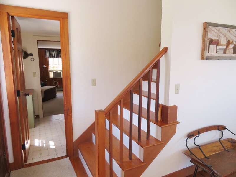 Bath on first floor and Bedroom 2 straight ahead-Stairway to 2nd floor with 2 bedrooms and a bath - 299 Cranberry Lane North Chatham Cape Cod New England Vacation Rentals  #BookNEVRDirectBarefootHome