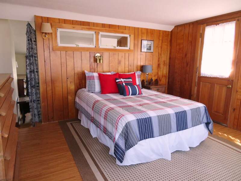 Bedroom #4 second floor Queen Bed and access to balcony/deck - 299 Cranberry Lane North Chatham Cape Cod New England Vacation Rentals  #BookNEVRDirectBarefootHome