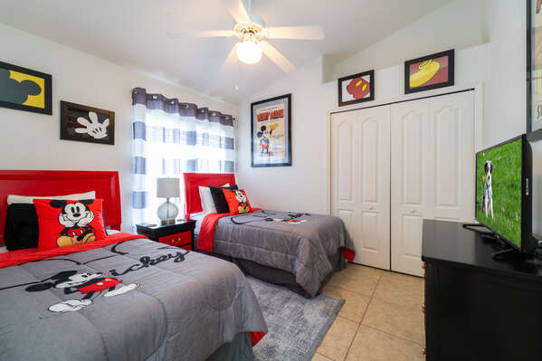 twin bedroom with 2 beds and TV