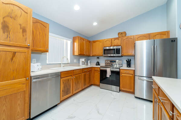 Kitchen has stainless steel appliances and is fully equipped