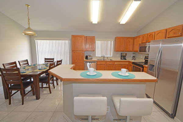 Kitchen with bar seating and table seating 6