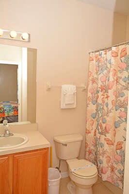 Bedroom 2 en-suite bathroom has a bath/combo and single vanity.  Shared with the main house (downstairs)