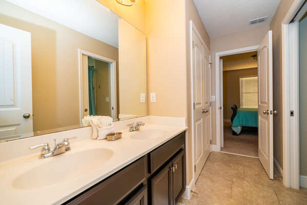Jack n Jill shared bathroom between bedrooms 2 and 3.  Has double basins, bath/shower combo and WC