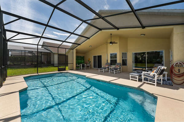 Pool view showing large covered lanai and seating