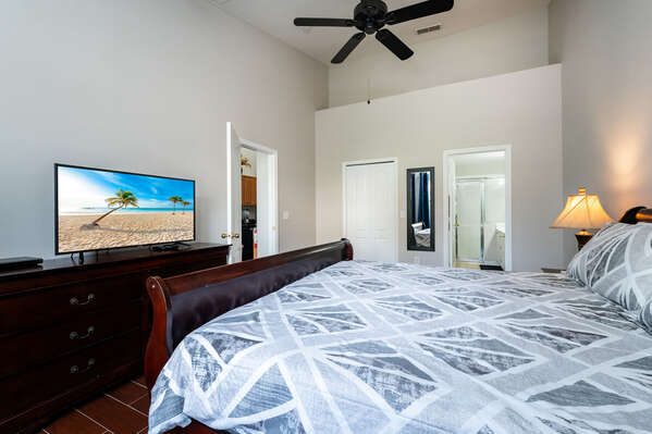 Master bedroom showing king bed and TV