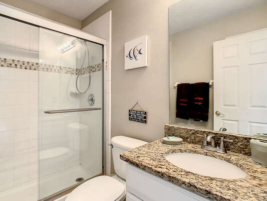 Shared loft bath showing shower and single sink vanity
