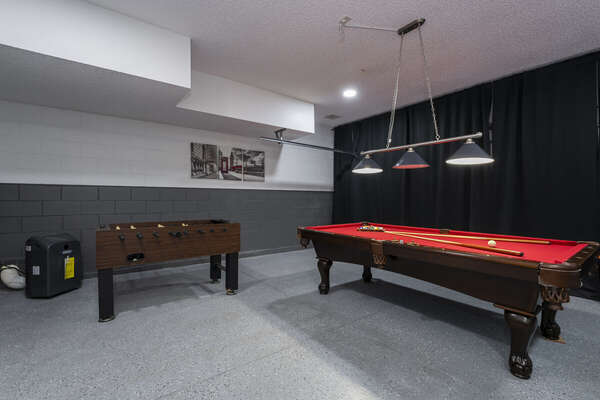Game room showing billiards table and foosball table and portable AC