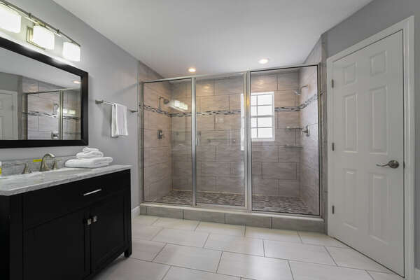 Master Suite bath with extra large 2-person shower, private toilet and single sink vanity