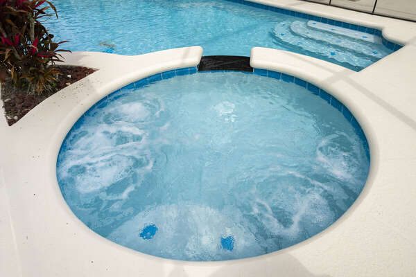 Bubbling spa with waterfall spillover to pool. Add spa heating for added enjoyment.