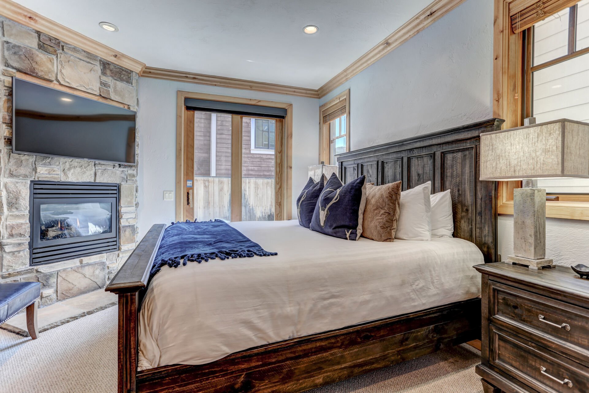 Grand master bedroom with king bed, fireplace, LED Smart TV, private deck & full bathroom