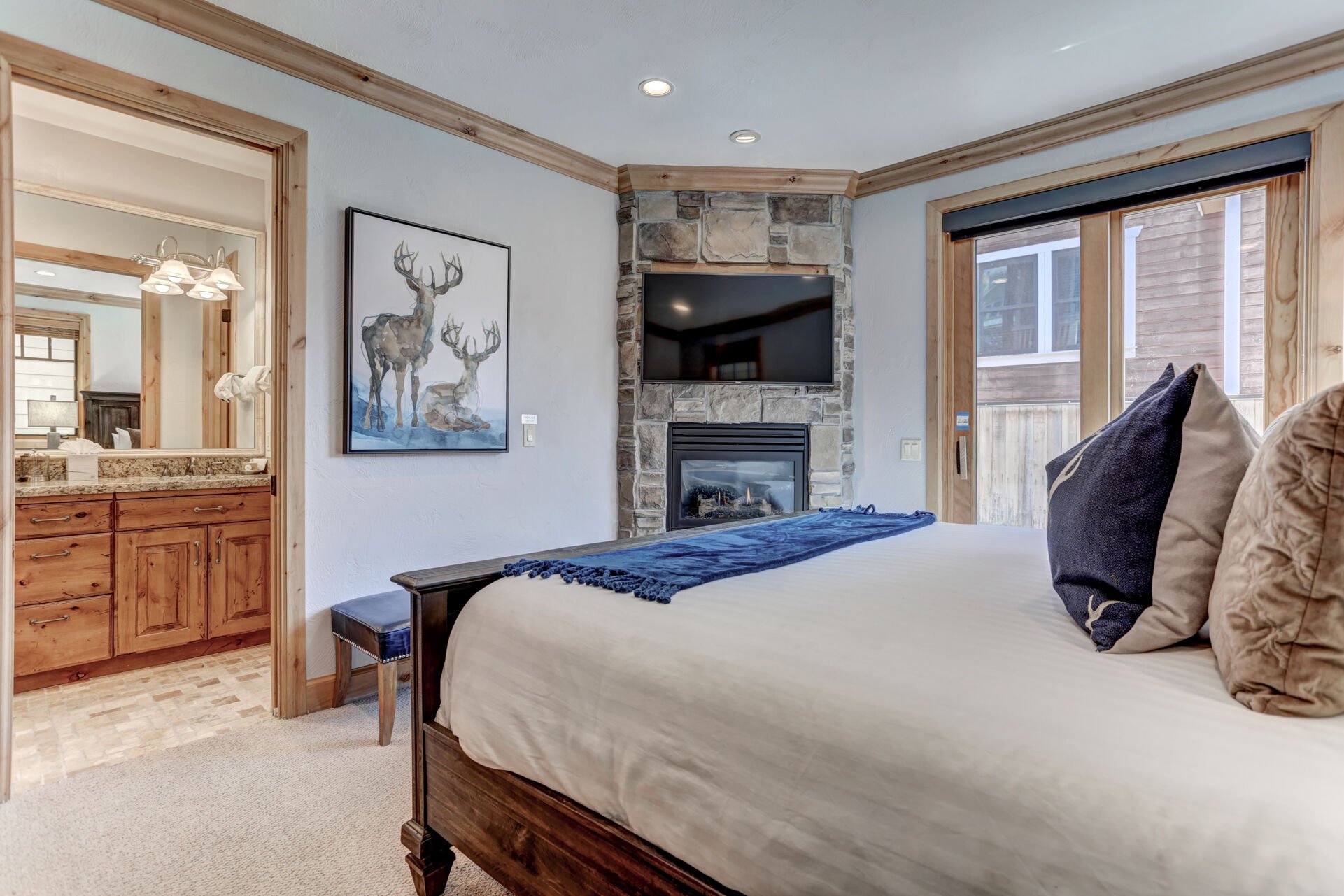 Grand master bedroom with king bed, fireplace, LED Smart TV, private deck & full bathroom
