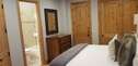 Second master bedroom suite with king bed, LED Smart TV, fireplace, and full private bathroom