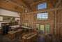 Open floor plan, and spectacular windows and wood beams