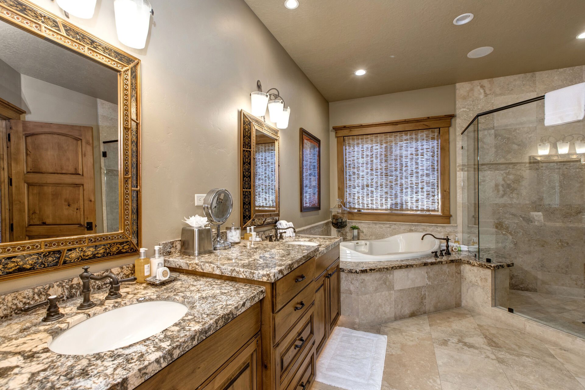 Master bath with jetted tub, large tiled shower, dual vanities, separate wash closet and walk-in closet