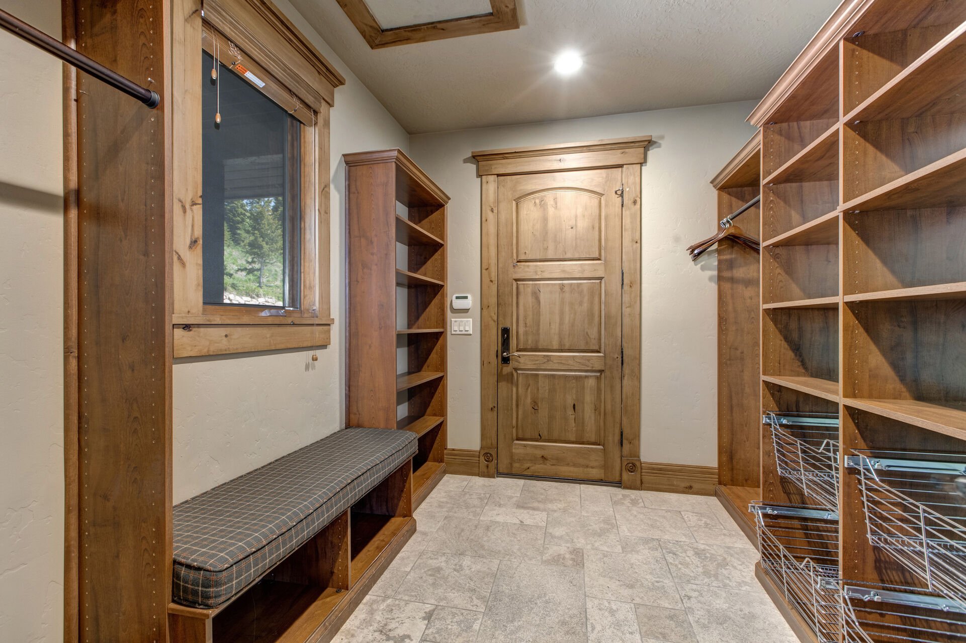 Upper Level entrance with mud room and storage
