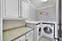 Laundry Room with Washer/Dryer and Folding Table