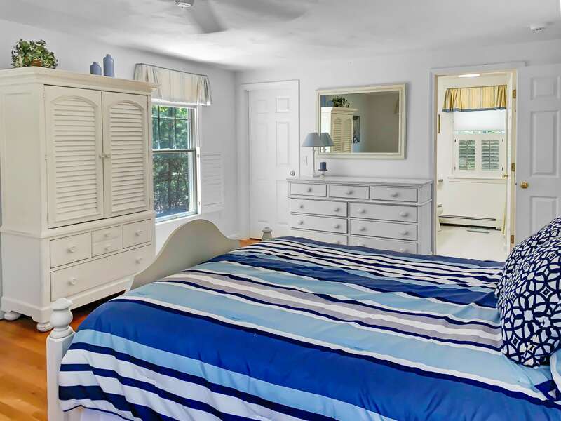 Bedroom #1,  master bedroom with a Queen bed, flat screen TV, and full en suite bath - 30 Cockle Cove Road Chatham Cape Cod New England Vacation Rentals