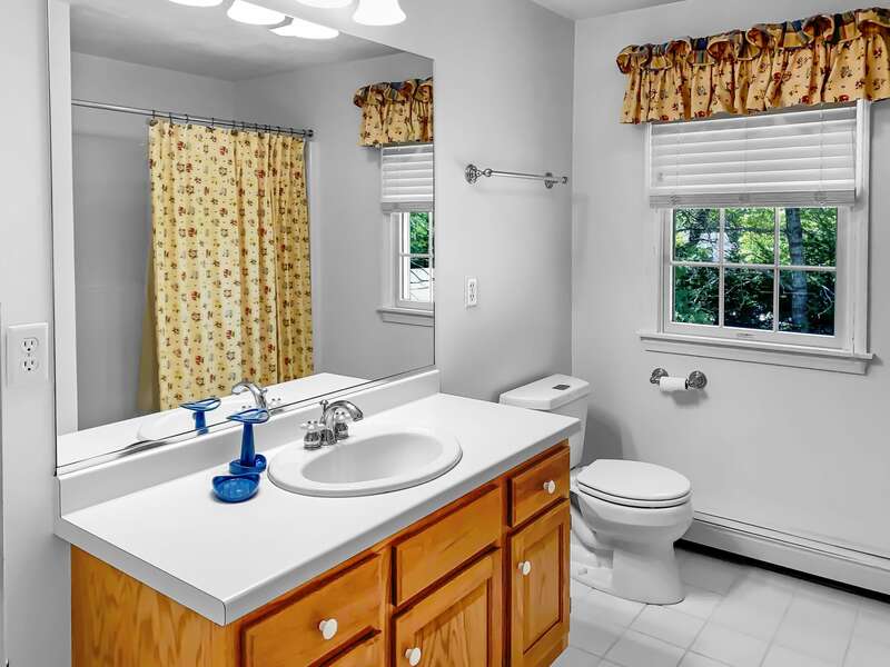 Full bathroom located on the second floor between bedrooms 2 & 3 with a tub and shower - 30 Cockle Cove Road Chatham Cape Cod New England Vacation Rentals