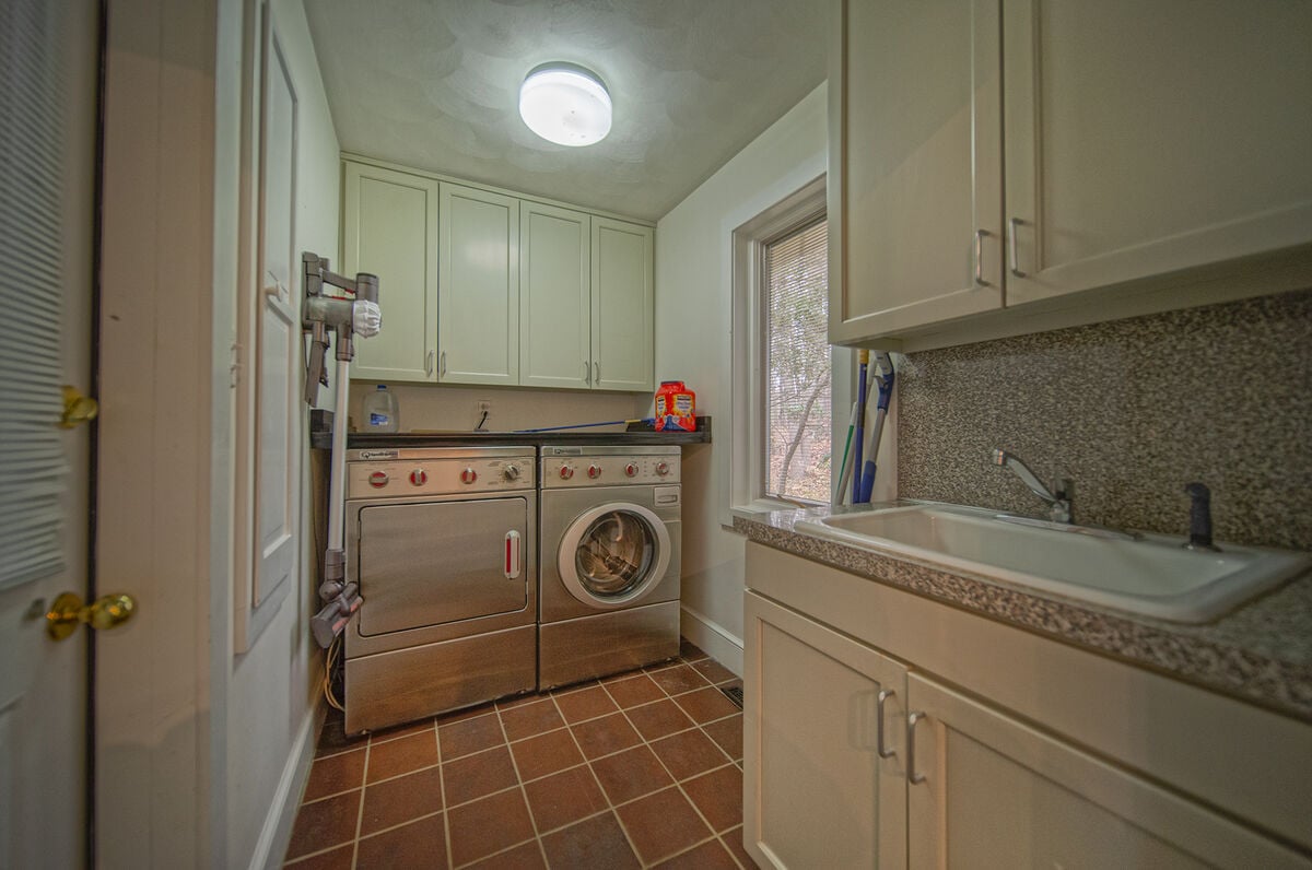 Laundry Room Features a Washer and Dryer.