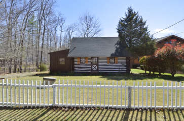 Image of Fenced-In Log Cabin.
