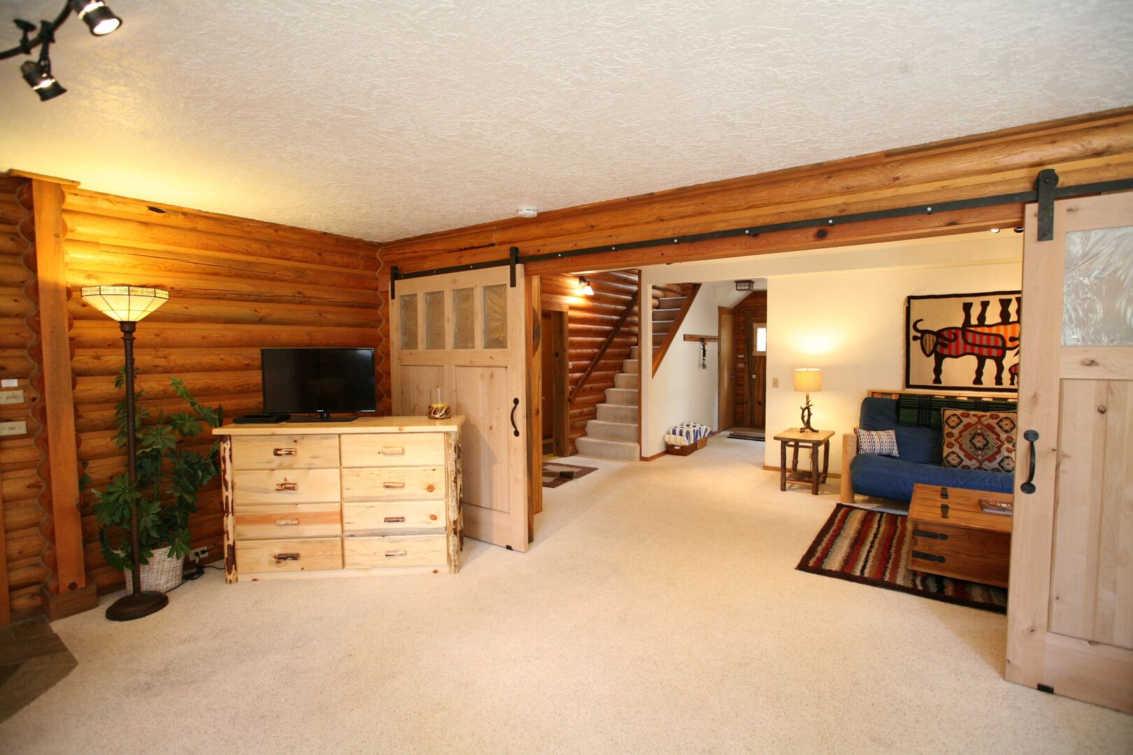 King Master - Downstairs - Spacious with barn doors and exterior access.