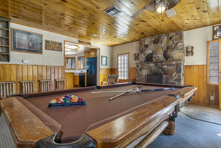 Challenge each other at a game of pool on the billiards table.