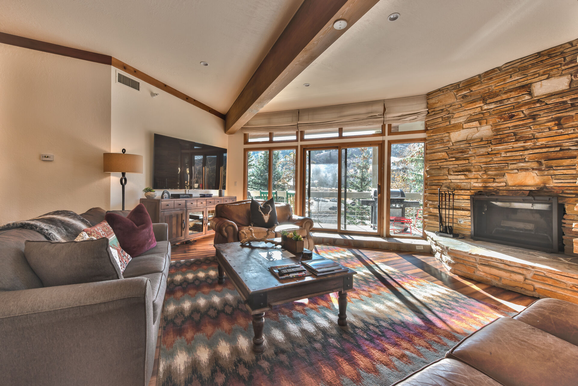 Living Room with Flat Screen TV, Wood Fireplace, New Queen Sleeper Sofa and Private Deck with Mountain Views!