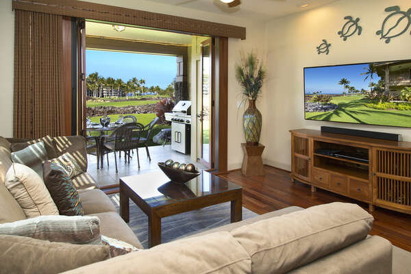 The living area of this Waikoloa Hawai'i vacation rental completely opens to the outside lanai.