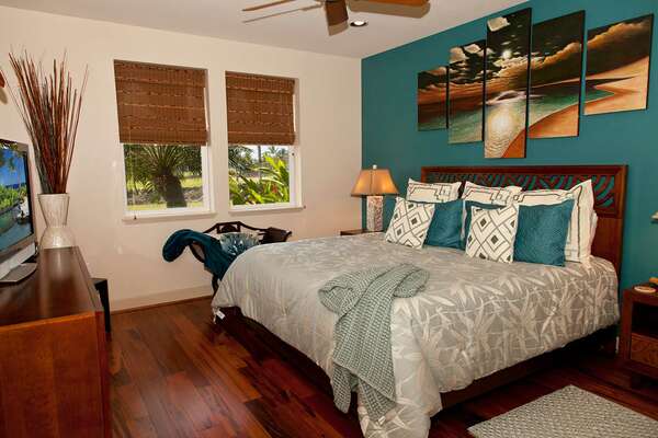 Primary Bedroom of this Waikoloa Hawai'i vacation rental with King Bed, Dresser, and TV on top.