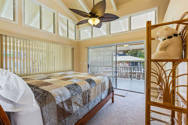 Den with Cal King Bed in front of a sliding glass door to the lanai.