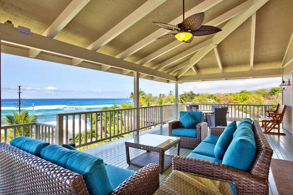 Lanai of this Kona Hawai'i vacation rental with cushioned seating and great views.