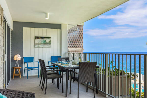 Spacious lanai with outdoor dining table.