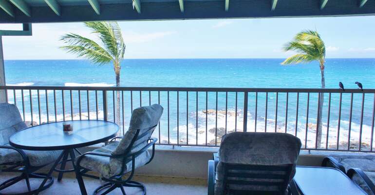 Oceanfront lanai with table and chairs