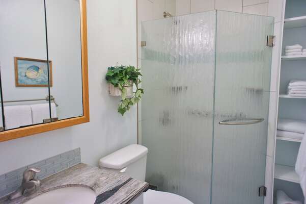 Bathroom with shower, toilet, and single bathroom vanity set